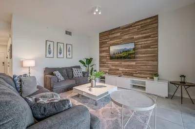 a living room with a couch and a table at Storey Lake Resort 1059 - Hosted by Top Villas in Kissimmee