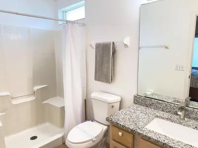 a bathroom with a toilet and a sink and a shower at LB4701PL - 4 Beds villa - with pool and game room in Kissimmee