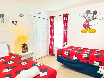 a bedroom with a mickey mouse mural on the wall at LB4701PL - 4 Beds villa - with pool and game room in Kissimmee