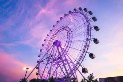 a ferris wheel with a purple sky in the background at Private Oasis near Springs with King Bd and Pool Table in Orlando