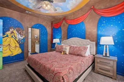 a bedroom with a bed with a disney mural at Free Arcade! All Rooms Themed! South Facing Pool! in Orlando