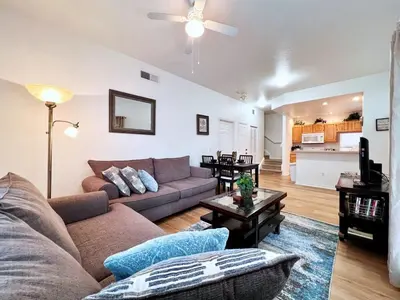 a living room with a couch and a table at Cute and Cozy 4Bed Townhome Venetian Bay-2200SCD in Kissimmee