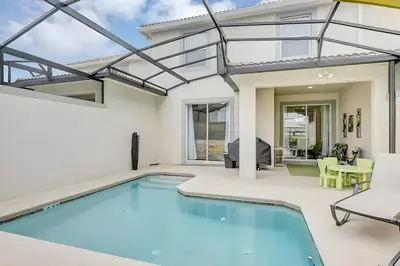 a swimming pool in the backyard of a house at Waterpark Disney wPoolLakeView Storey Lake in Kissimmee