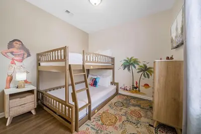 a bedroom with two bunk beds and a mural at 4024 Breakview Drive 303 in Orlando