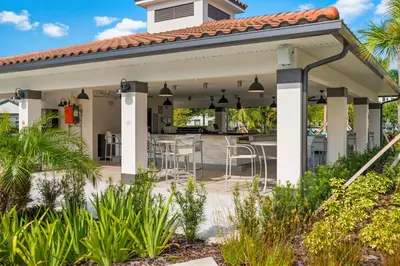 a pavilion with a table and chairs on a patio at 4024 Breakview Drive 303 in Orlando