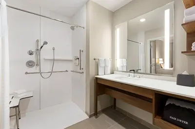 a bathroom with a sink and a shower at Staybridge Suites Clermont Southeast by IHG in Clermont