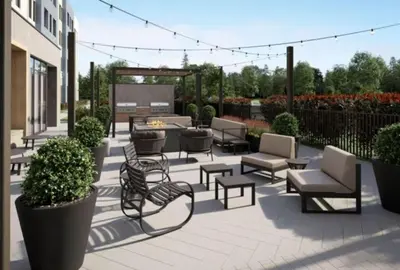 a patio with chairs and tables and a fire pit at Staybridge Suites Clermont Southeast by IHG in Clermont