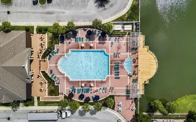 an overhead view of a swimming pool with a resort at 4 Bedroom 3 Bathroom Villas At SevenDwarfs 17-101 in Kissimmee