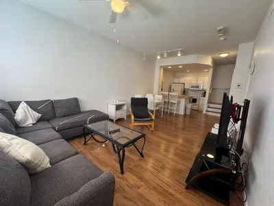 a living room with a gray couch and a table at 3 Bedroom 2 Bathroom Villas At SevenDwarfs 8-103 in Kissimmee