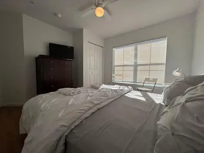 a bedroom with a bed with a dresser and a window at 3 Bedroom 2 Bathroom Villas At SevenDwarfs 8-103 in Kissimmee