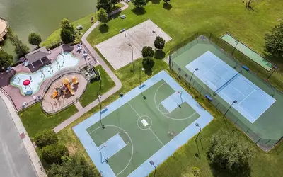 an overhead view of two tennis courts on a field at 3 Bedroom 2 Bathroom Villas At SevenDwarfs 8-103 in Kissimmee