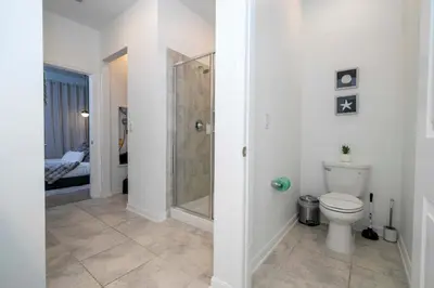 a bathroom with a shower and a toilet at 3191#402 Family Fun 3BR Themed Apt Near Disney in Kissimmee