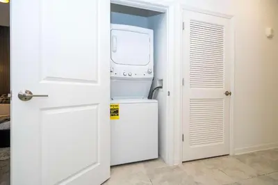 a white washer and dryer in a room at 3191#402 Family Fun 3BR Themed Apt Near Disney in Kissimmee