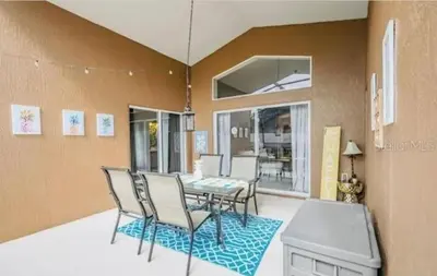 a dining room with a table and chairs at Enchanted Disney Vacation Villa in Kissimmee