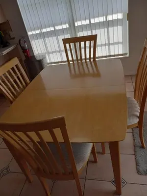 a wooden table with two chairs and a dining room at Fabulous 4 Bed South Facing Lake View Near Disney in Orlando