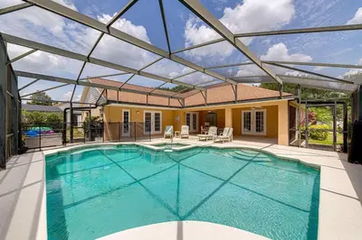 a swimming pool in a house with a glass ceiling at Spacious 4 Bed South Facing Pool Villa Near Disney in Orlando