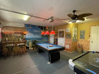 a room with a pool table and a bar at Hidden Waterfront Oasis - 18 Minutes To The Disney in Orlando