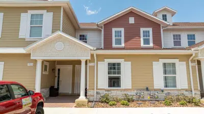 a house with a red car parked in front of it at Luxury 3BR home with Mario Bros Room Near Disney in Orlando