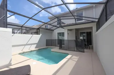an indoor swimming pool in a house with a glass ceiling at Perfect Storey Lake Home for Great Vacation in Kissimmee