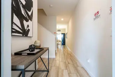 a hallway with a console table and a hallway with a hallway at Great Home Mickey & Harry Potter Beds Top Spot in Kissimmee