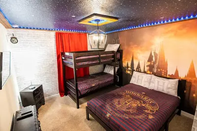 a bedroom with a bed with a hogwartsvelt at Great Home Mickey & Harry Potter Beds Top Spot in Kissimmee