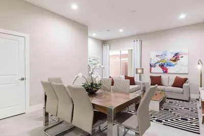 a dining room with a table and chairs at Chic 4 Bedroom at Summerville Minutes from Disney in Orlando