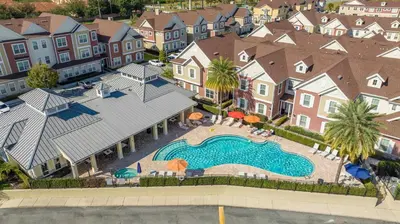 an aerial view of a swimming pool in a residential neighborhood at Chic 4 Bedroom at Summerville Minutes from Disney in Orlando