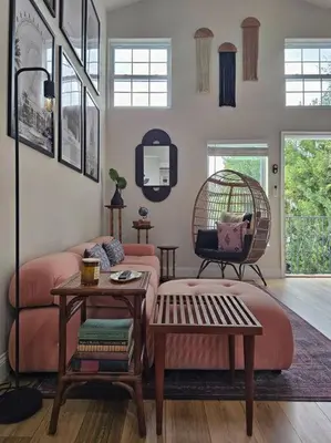 a living room with a pink couch and a swing at The Catherine - 1 mile to downtown - 2 King beds - Sleeps 5 in Orlando