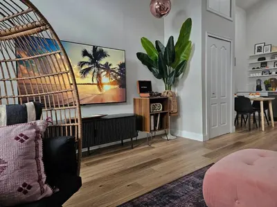 a living room with a swing chair and a table at The Catherine - 1 mile to downtown - 2 King beds - Sleeps 5 in Orlando