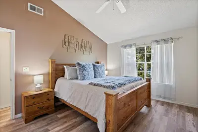 a bedroom with a large bed and a window at 2721 North Poinciana #164 in Kissimmee