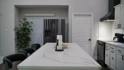 a kitchen with a white counter top in a room at Luxury home with Pool & 6 Beds near Disney in Kissimmee