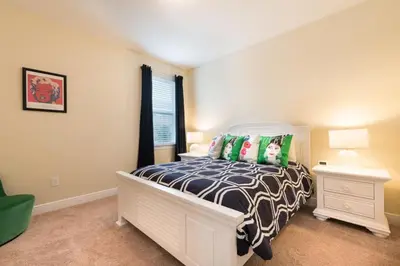 a bedroom with a bed and a window at Fabulous Disney Vacation Home in Orlando