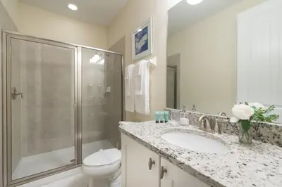 a bathroom with a toilet and a sink and a shower at Fabulous Disney Vacation Home in Orlando