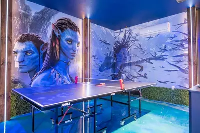 a ping pong table in front of a mural at Fabulous Disney Vacation Home in Orlando