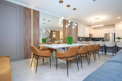 a dining room with a table and chairs at The Ultimate 9bd Disney Getaway Storey Lake in Kissimmee