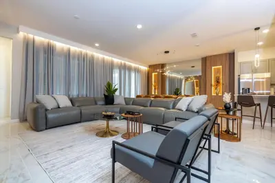 a living room with a couch and a table at The Best Paradiso Vacation House in Orlando