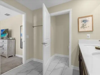 a bathroom with a sink and a mirror at Comfortable 4 Bedrooms at Storey Lake in Kissimmee
