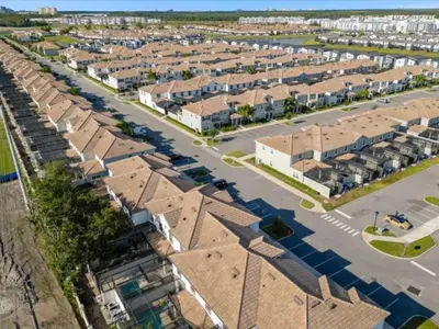 an aerial view of a city with houses at Comfortable 4 Bedrooms at Storey Lake in Kissimmee