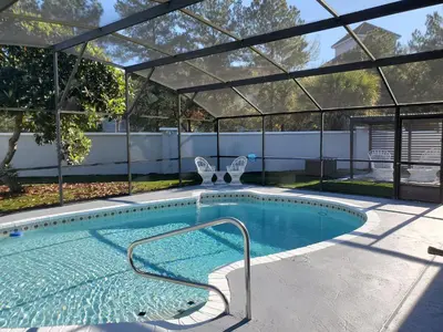 a swimming pool with a pergola and a swimming pool at Wonderful Villa with swimming pool, near Orlando attractions in Kissimmee