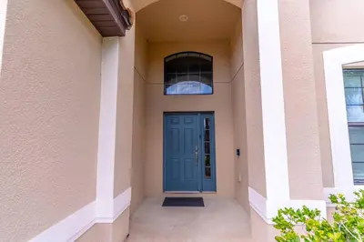 a blue door on the side of a building at 2614 Veranda Palms in Kissimmee
