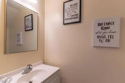 a bathroom with a sink and a mirror at 2614 Veranda Palms in Kissimmee
