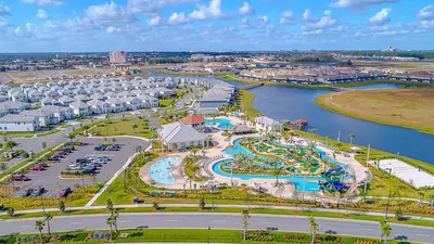 an aerial view of a resort with a water park at 2585LA TOWNHOUSE 4 BEDROOMS & 3 BATHROOMS + POOL in Kissimmee