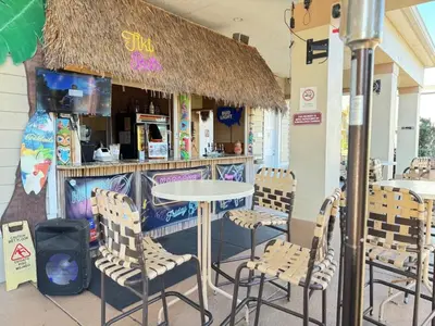 a restaurant with a table and chairs in front of it at 4 Bedroom 3 Bathroom Villas At SevenDwarfs 12-108 in Kissimmee