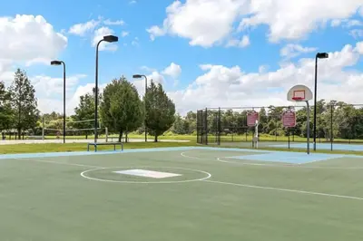 a basketball court with a basketball hoop at 4 Bedroom 3 Bathroom Villas At SevenDwarfs 12-108 in Kissimmee