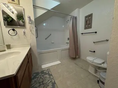 a bathroom with a shower and a sink and a toilet at 3 Bedroom 2 Bathroom Villas At SevenDwarfs 21-103 in Kissimmee
