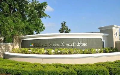 a sign in front of a building with a sign at 3 Bedroom 2 Bathroom Villas At SevenDwarfs 27-106 in Kissimmee