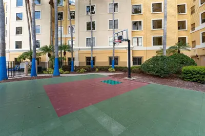 a basketball court in front of a building at Cozy Orlando Getaway with Pool Access in Orlando