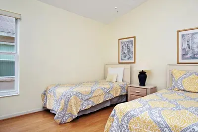 a bedroom with two beds and a window at Indian Creek Vacation Home Close to Disney villa in Orlando