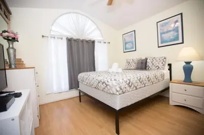 a bedroom with a bed and a window at Indian Creek Vacation Home Close to Disney villa in Orlando