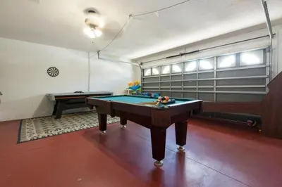 a room with a pool table in it at Indian Creek Vacation Home Close to Disney villa in Orlando